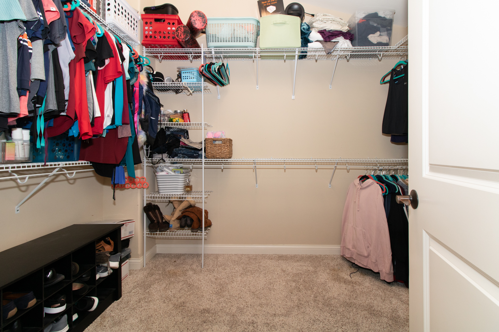 4002 Rockledge Road Bloomington, IL 61705 - Photo 35 of 60 a view of walk in closet with clothes and shoes