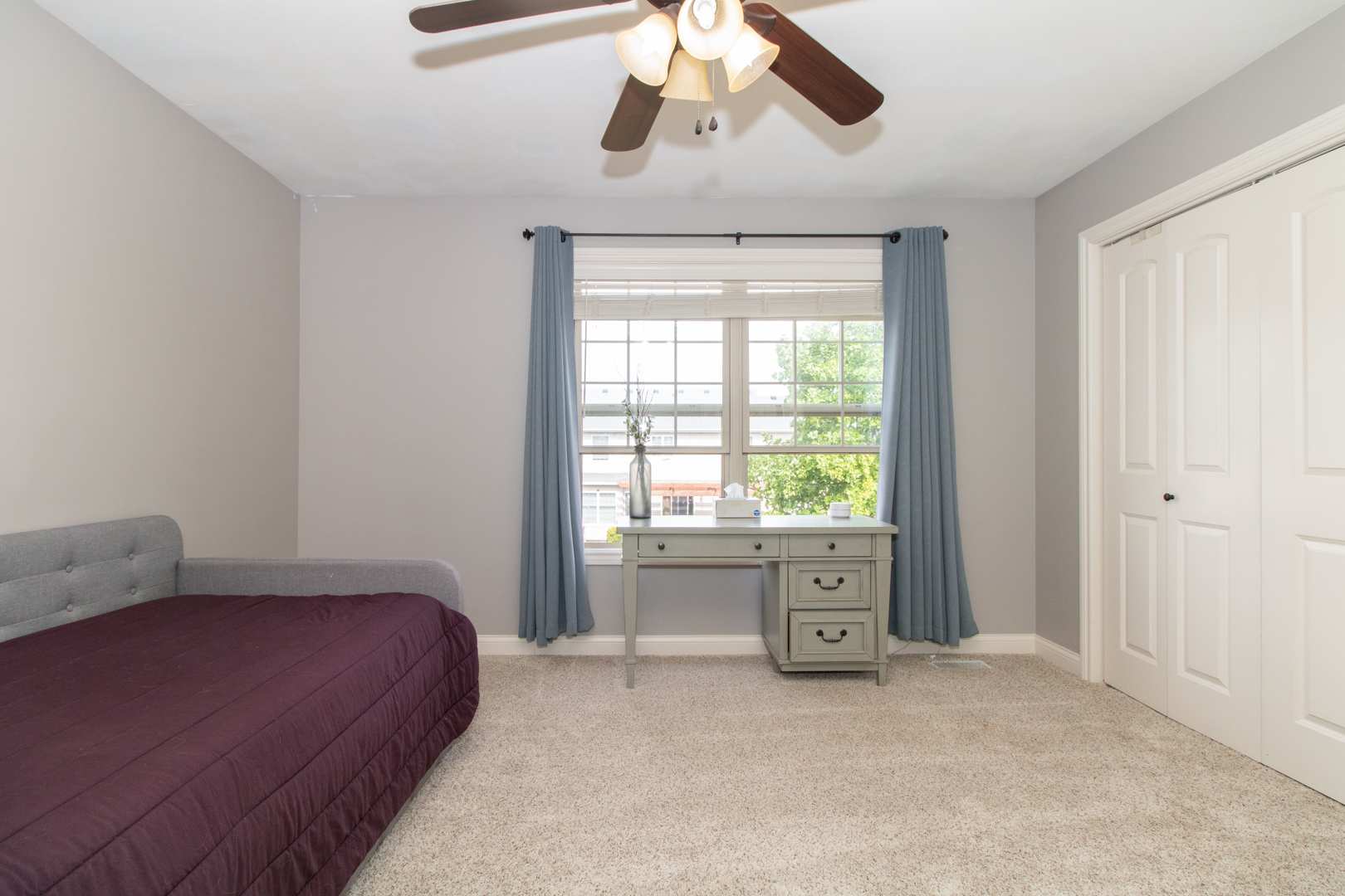 4002 Rockledge Road Bloomington, IL 61705 - Photo 39 of 60 a bedroom with a bed and a chandelier