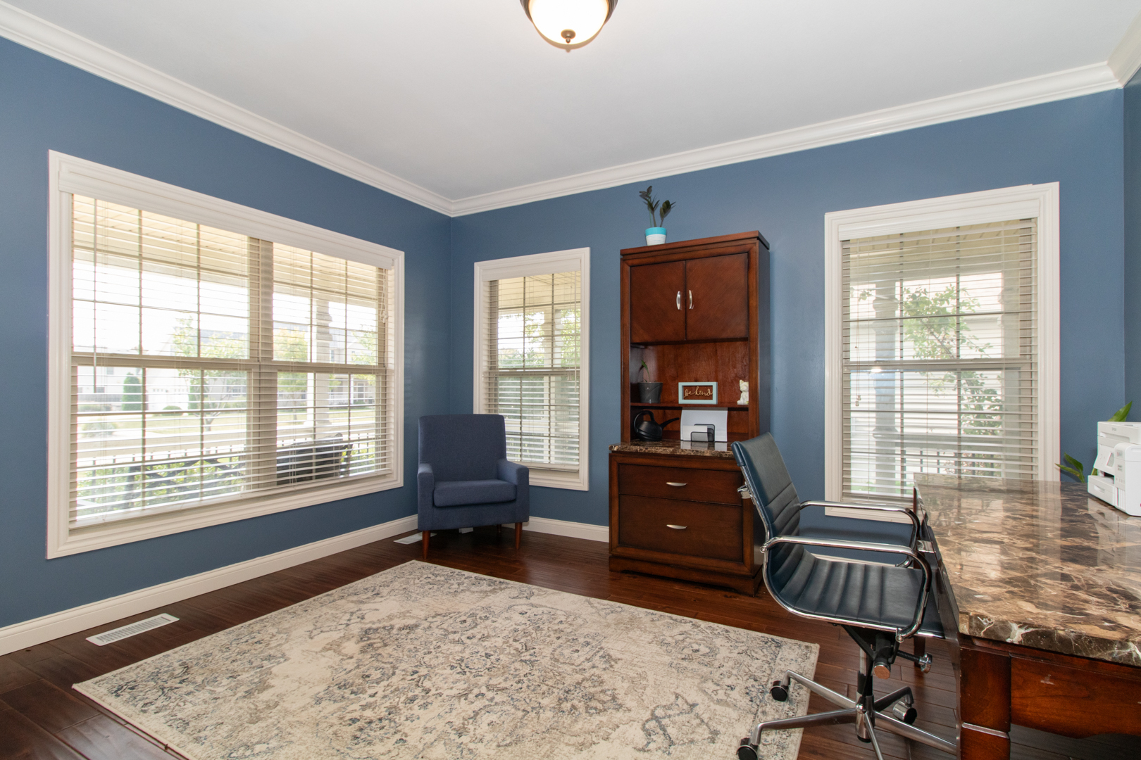 4002 Rockledge Road Bloomington, IL 61705 - Photo 4 of 60 a bedroom with a bed and wooden floor