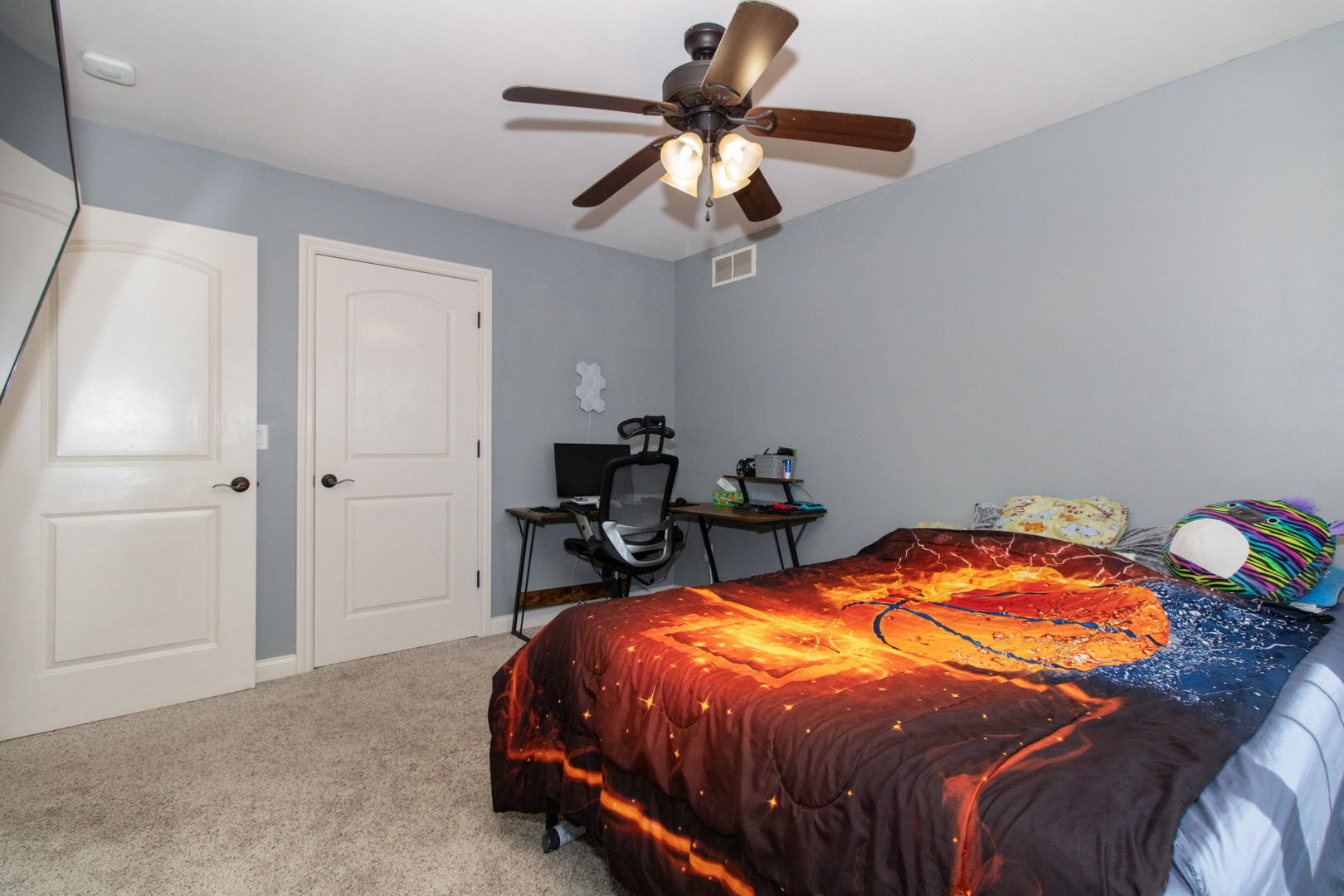 4002 Rockledge Road Bloomington, IL 61705 - Photo 43 of 60 a bed sitting in a bedroom next to a window