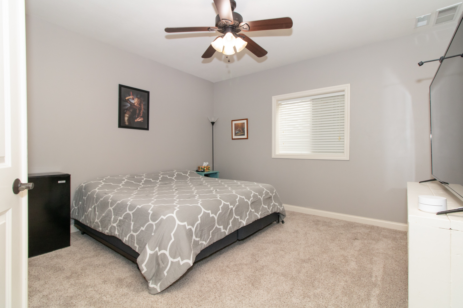 4002 Rockledge Road Bloomington, IL 61705 - Photo 56 of 60 a bedroom with a bed and a chandelier