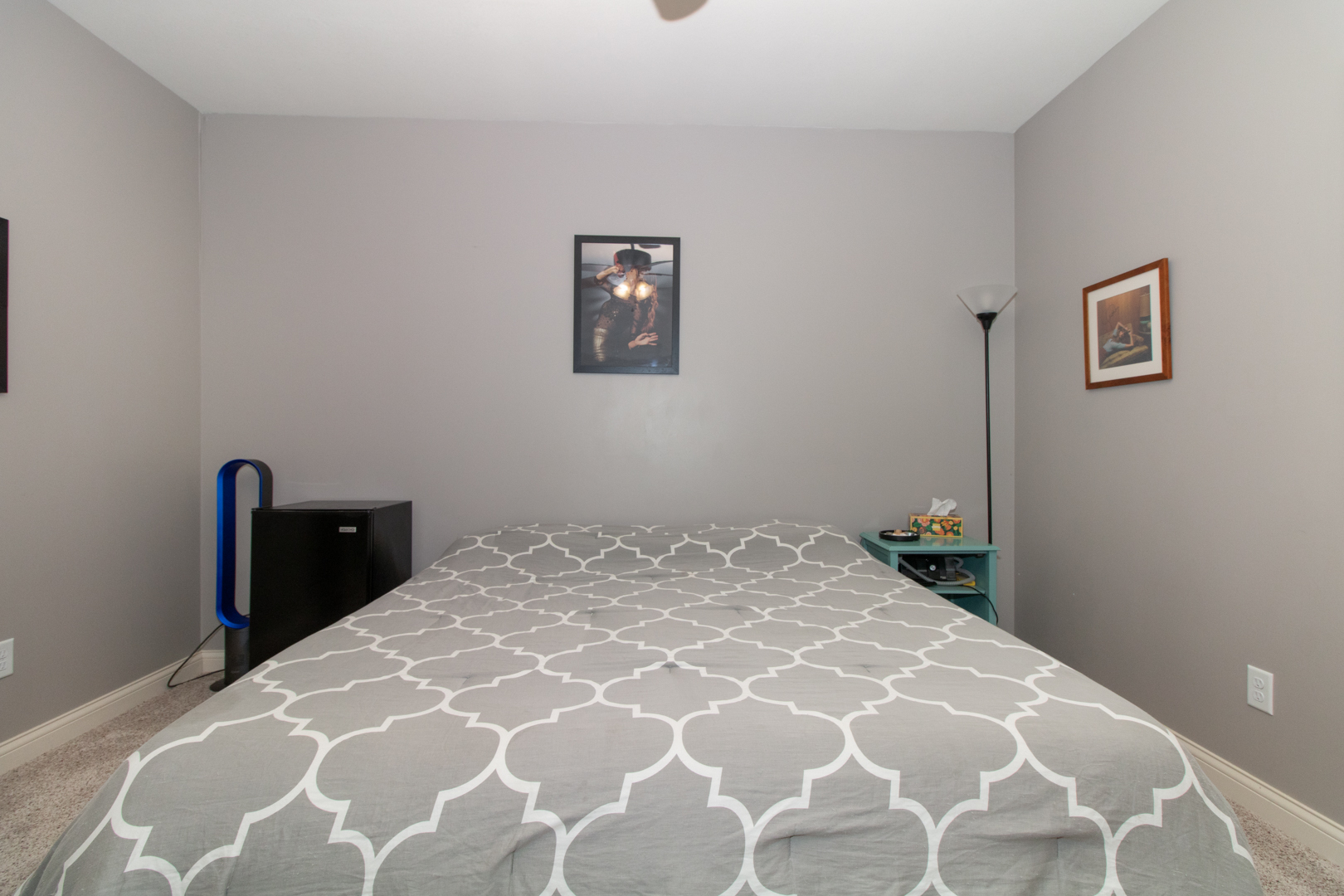 4002 Rockledge Road Bloomington, IL 61705 - Photo 57 of 60 a bedroom with a bed and a lamp