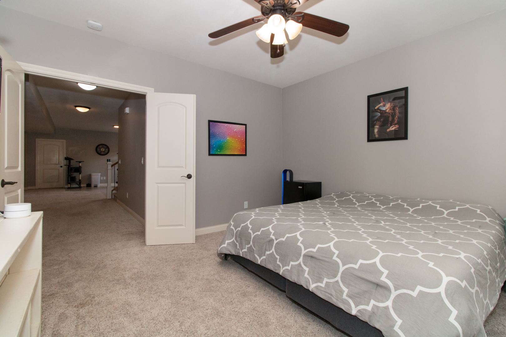 4002 Rockledge Road Bloomington, IL 61705 - Photo 58 of 60 a bedroom with a bed and a chandelier