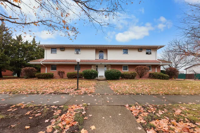 a front view of a house with street