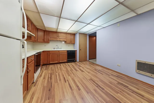 a view of a room with wooden floor and roof