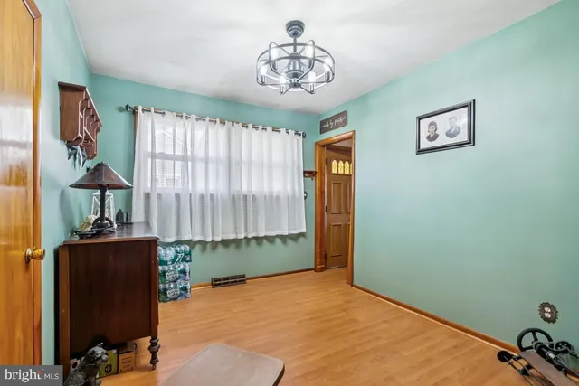 a view of a porch with a table and chairs