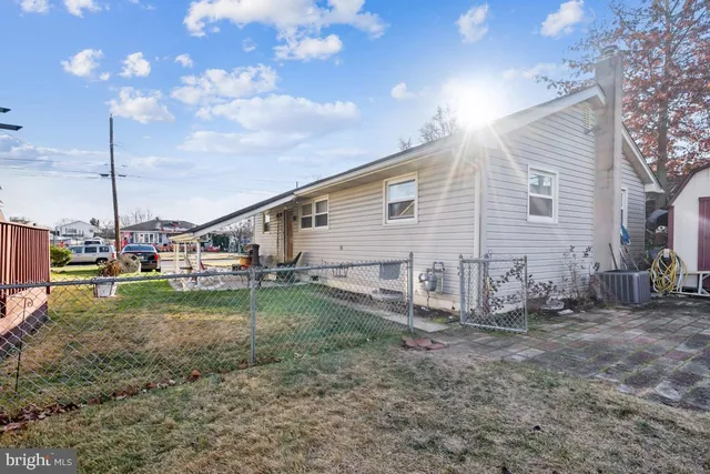 a view of dirt yard with a fountain