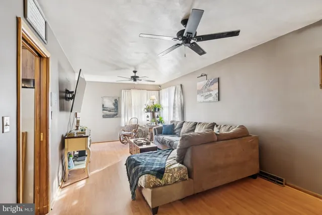 a bedroom with furniture and a flat screen tv