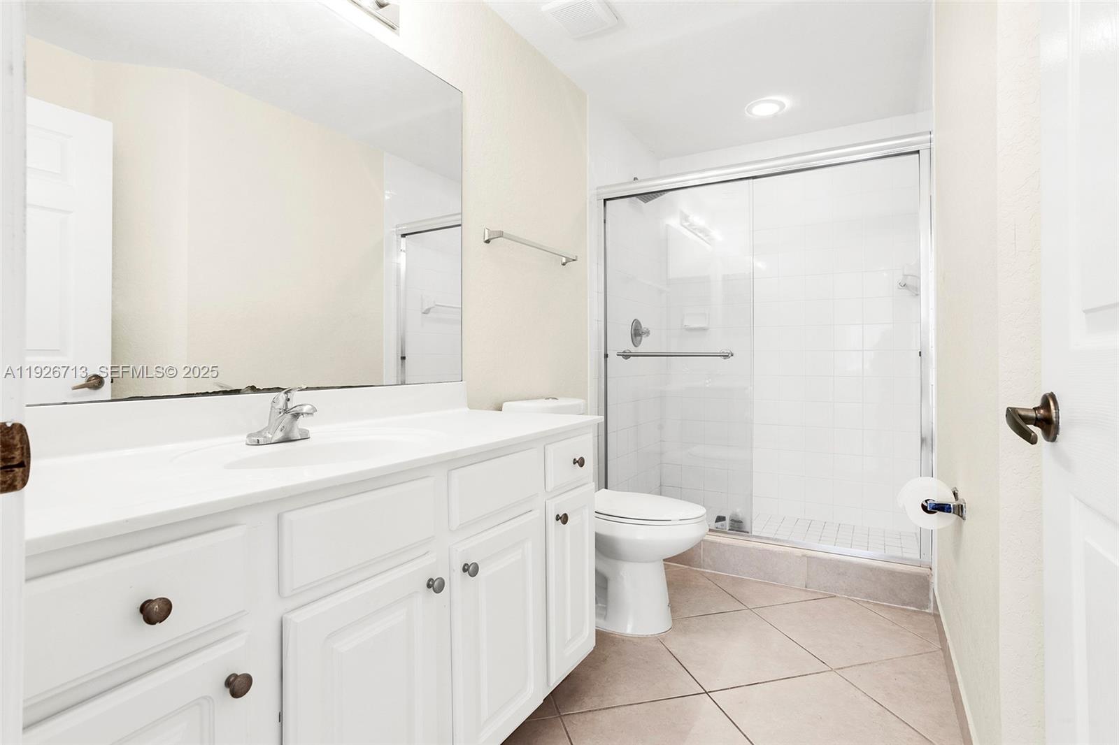 3340 Palomino Drive, Unit 2112 Davie, FL 33024 - Photo 12 of 25 a bathroom with a sink a toilet and shower