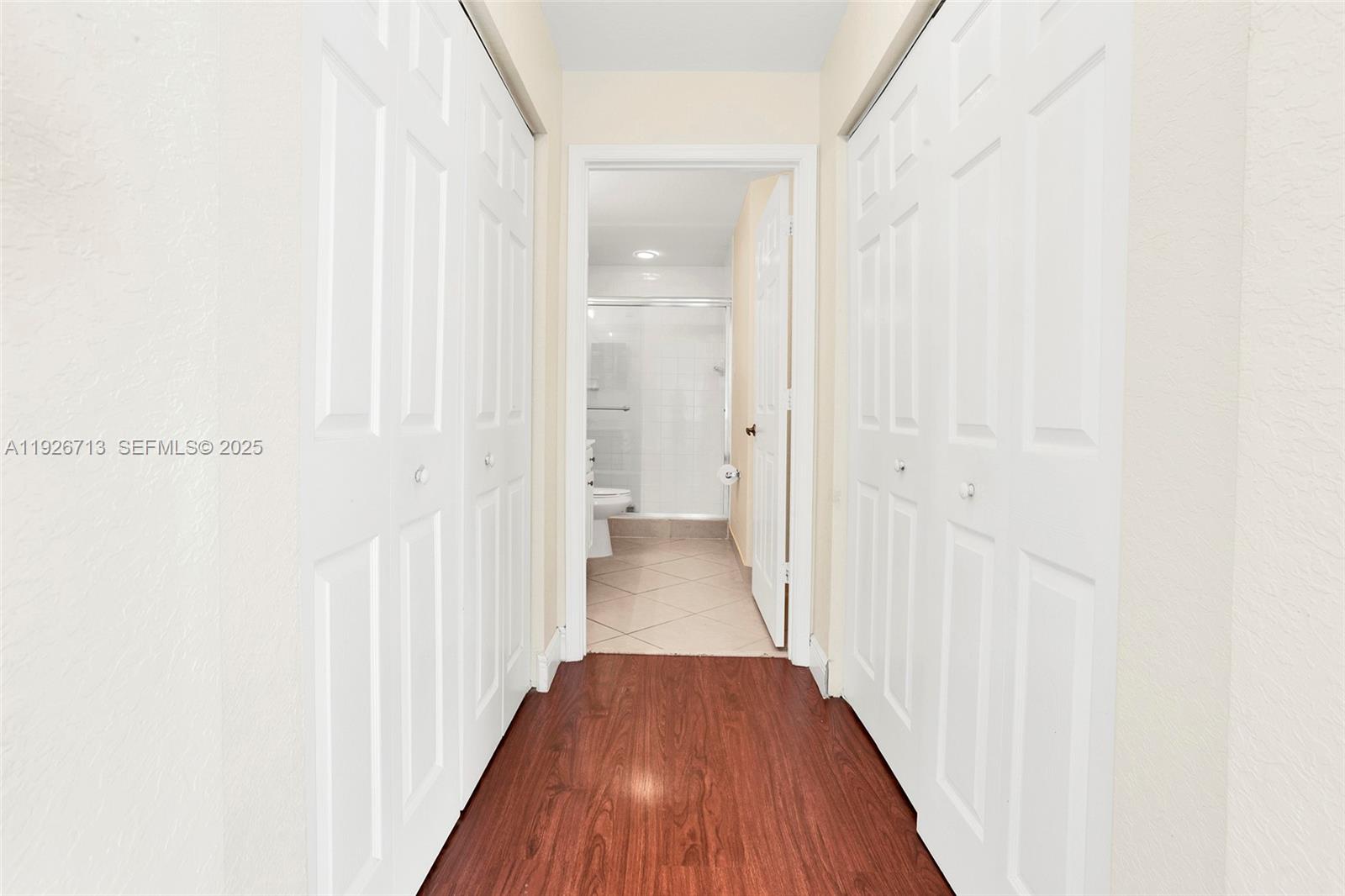 3340 Palomino Drive, Unit 2112 Davie, FL 33024 - Photo 13 of 25 a view of a hallway with wooden floor