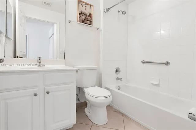 a bathroom with a sink a toilet and a bathtub