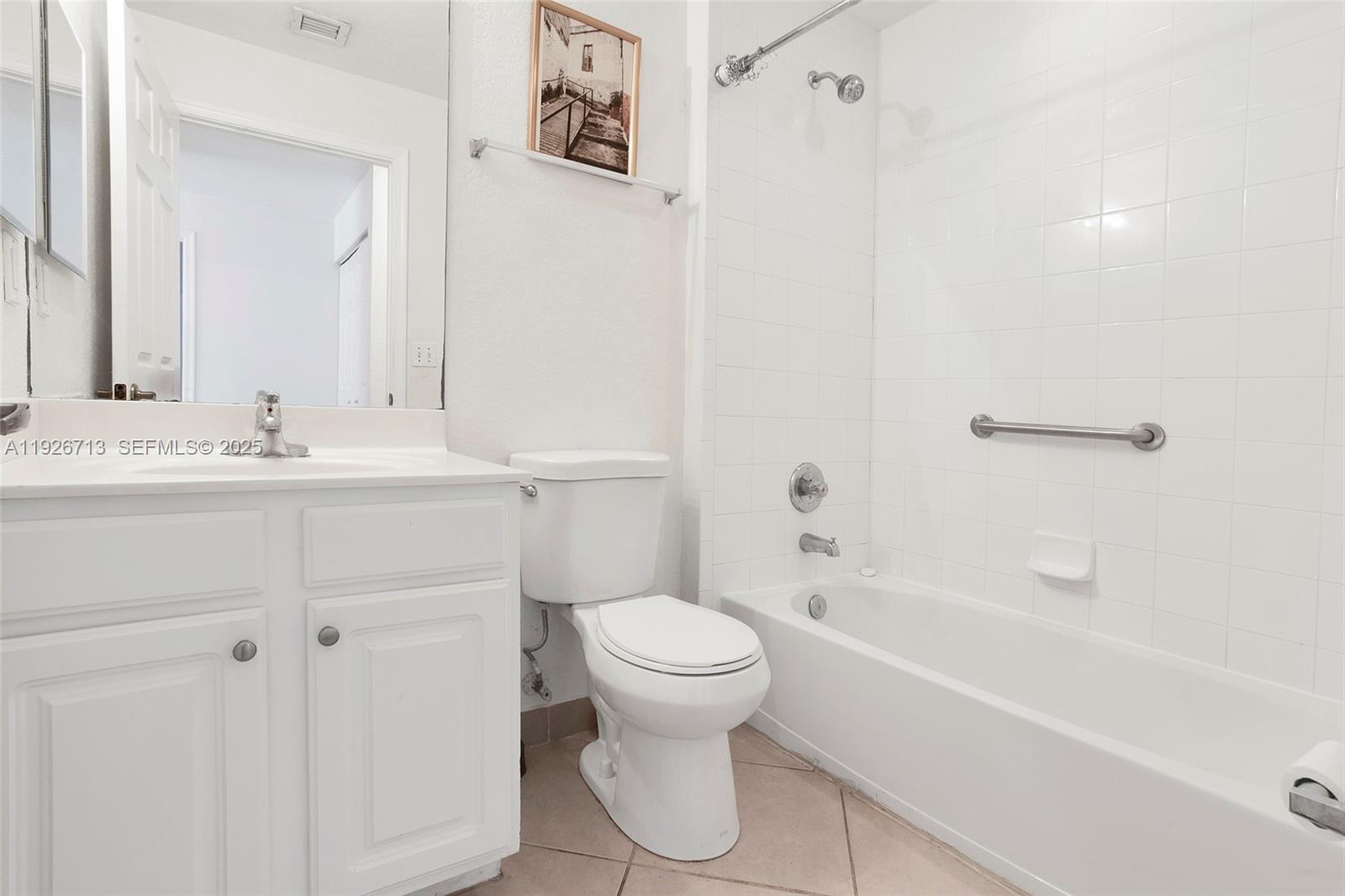 3340 Palomino Drive, Unit 2112 Davie, FL 33024 - Photo 17 of 25 a bathroom with a sink a toilet and a bathtub