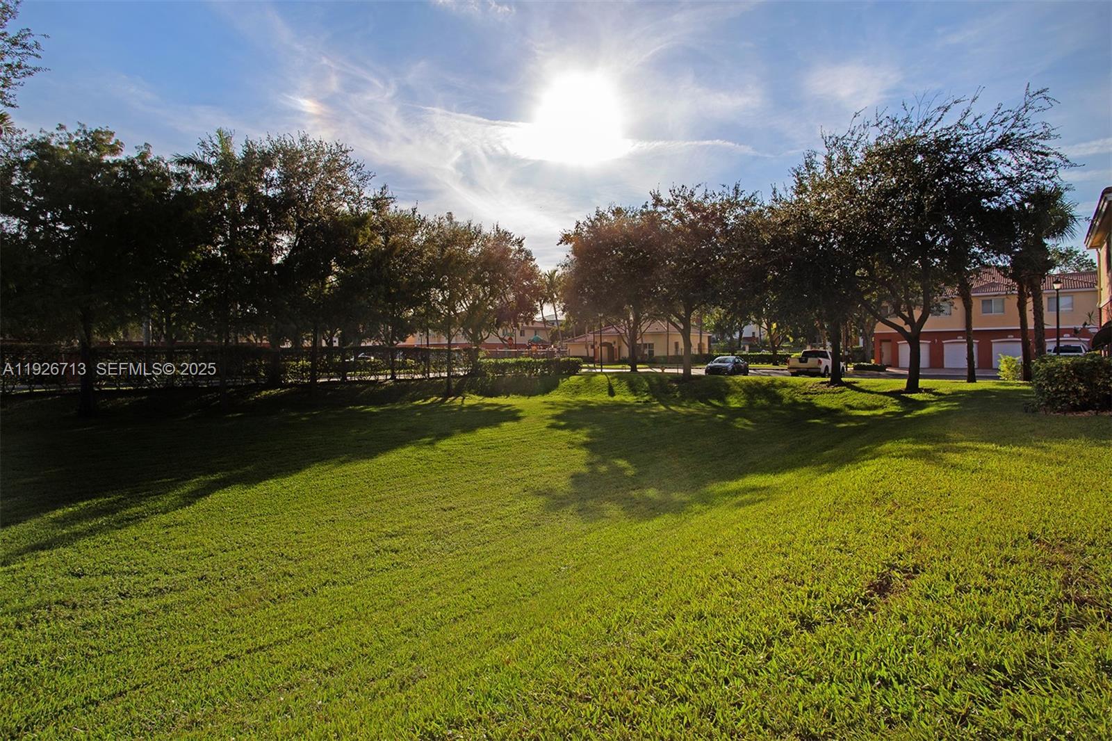 3340 Palomino Drive, Unit 2112 Davie, FL 33024 - Photo 22 of 25 a view of a lake with houses