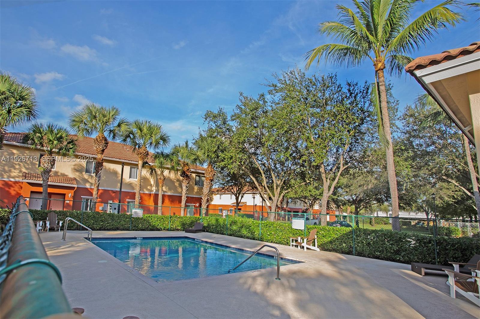 3340 Palomino Drive, Unit 2112 Davie, FL 33024 - Photo 24 of 25 a front view of a house with a yard