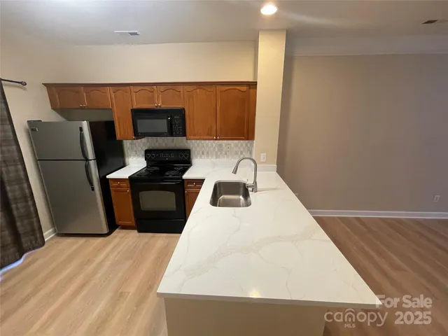 a view of room with window and hardwood