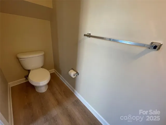 a view of staircase with wooden floor and staircase