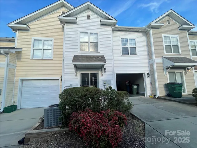 a view of a wooden door and a tree