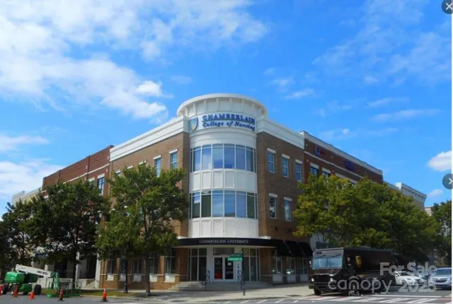 a view of a brick building with large windows