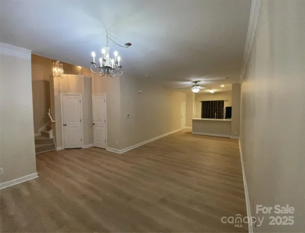 a kitchen with a sink a refrigerator and cabinets