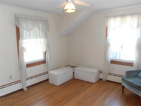 54 Denver Street Springfield, MA 01109 - Photo 16 of 30 a living room with furniture and a window