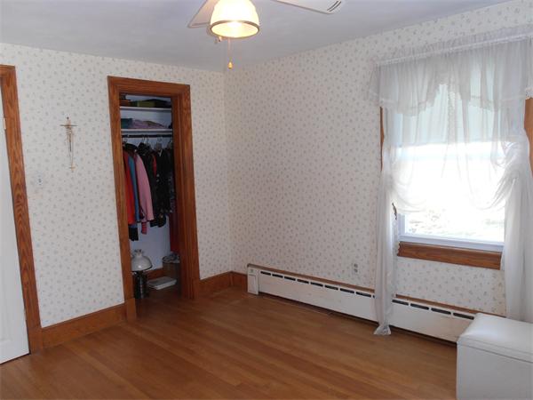 54 Denver Street Springfield, MA 01109 - Photo 17 of 30 a view of a room with wooden floor and a window