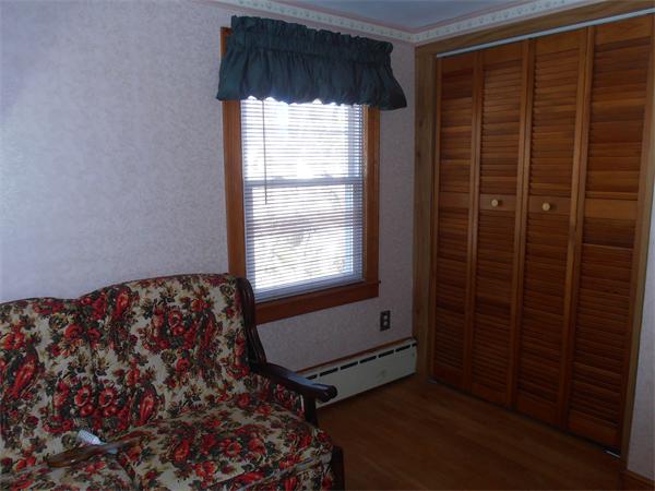 54 Denver Street Springfield, MA 01109 - Photo 19 of 30 a bedroom with a bed and a window