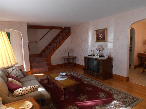 54 Denver Street Springfield, MA 01109 - Photo 2 of 30 a living room with furniture and a flat screen tv