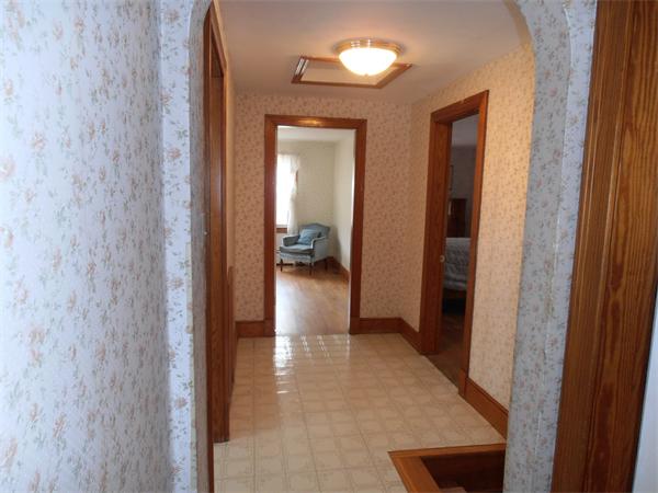 54 Denver Street Springfield, MA 01109 - Photo 22 of 30 a view of a hallway with a furniture and a mirror