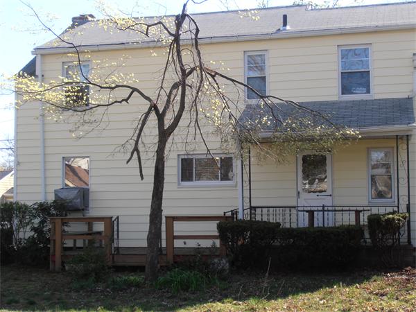 54 Denver Street Springfield, MA 01109 - Photo 25 of 30 a front view of a house with a yard