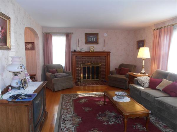 54 Denver Street Springfield, MA 01109 - Photo 3 of 30 a living room with furniture and a fireplace