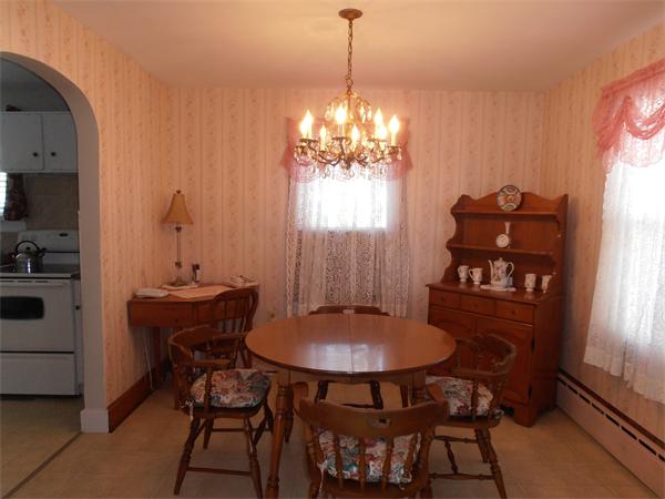 54 Denver Street Springfield, MA 01109 - Photo 5 of 30 a view of a dining room with furniture and window