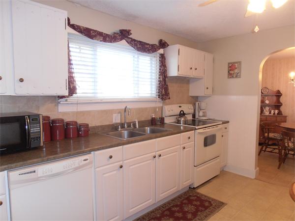 54 Denver Street Springfield, MA 01109 - Photo 8 of 30 a kitchen with cabinets and window