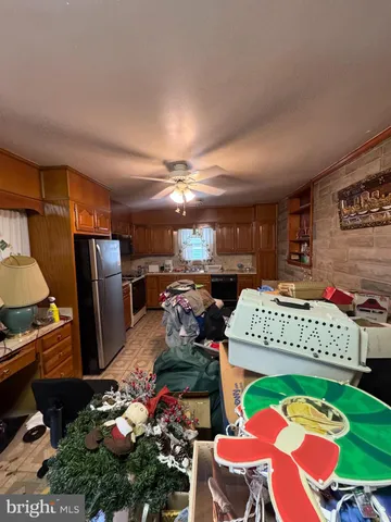 a kitchen with a stove a sink and a microwave