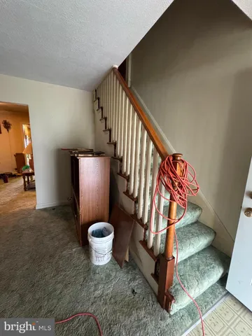 a living room with furniture a couch and a window