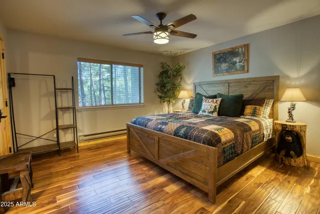 a bathroom with a granite countertop sink and a window