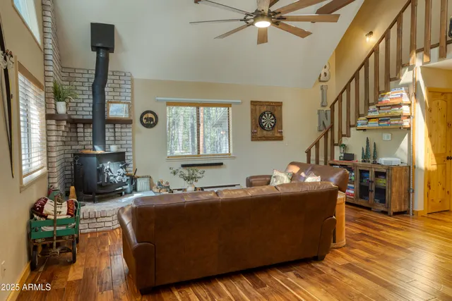 a living room with furniture window and wooden floor