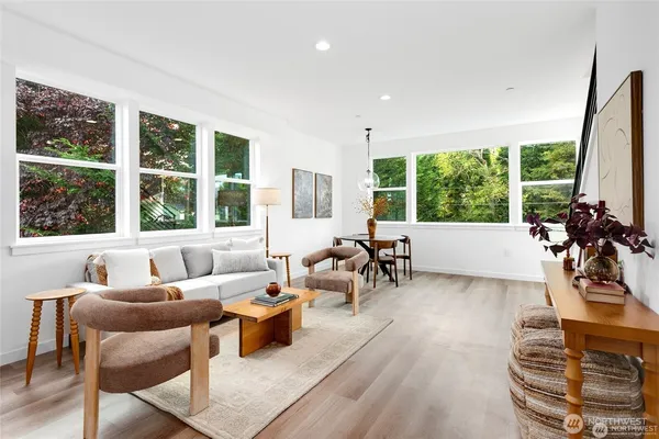 a living room with furniture and a large window