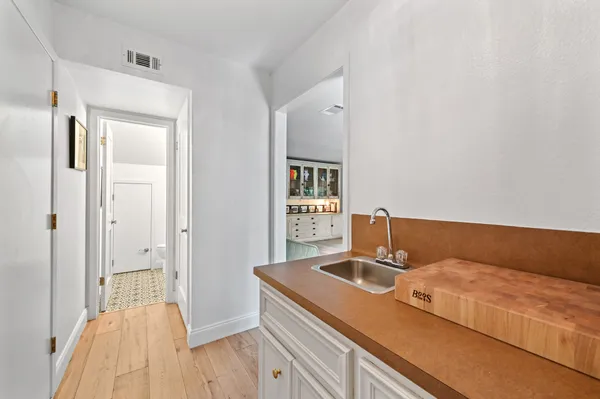 a bedroom with bed and flat screen tv