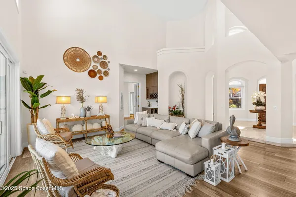 a living room with furniture and a potted plant