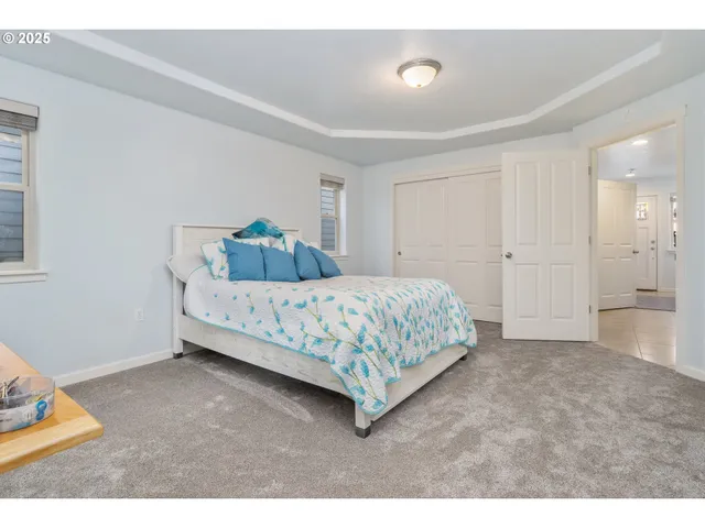 a bedroom with a bed and a cabinets