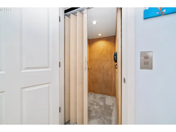 a bathroom with a shower and a mirror