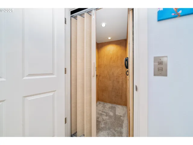 a bathroom with a shower and a mirror