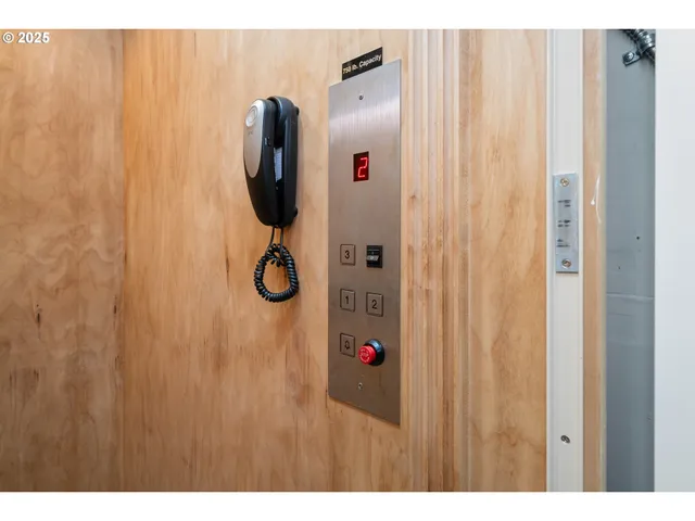 a bathroom with a shower curtain and a window