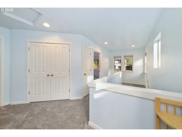 a room with a sink and a mirror