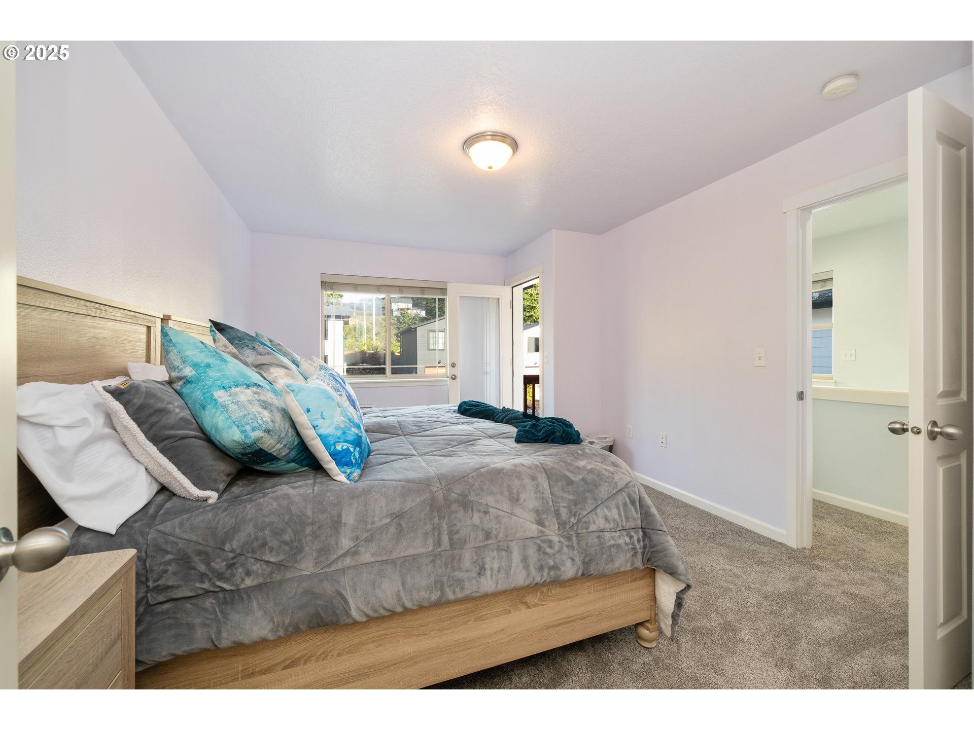 140 Breezee Way Tillamook, OR 97141 - Photo 20 of 46 a bedroom with a bed and window