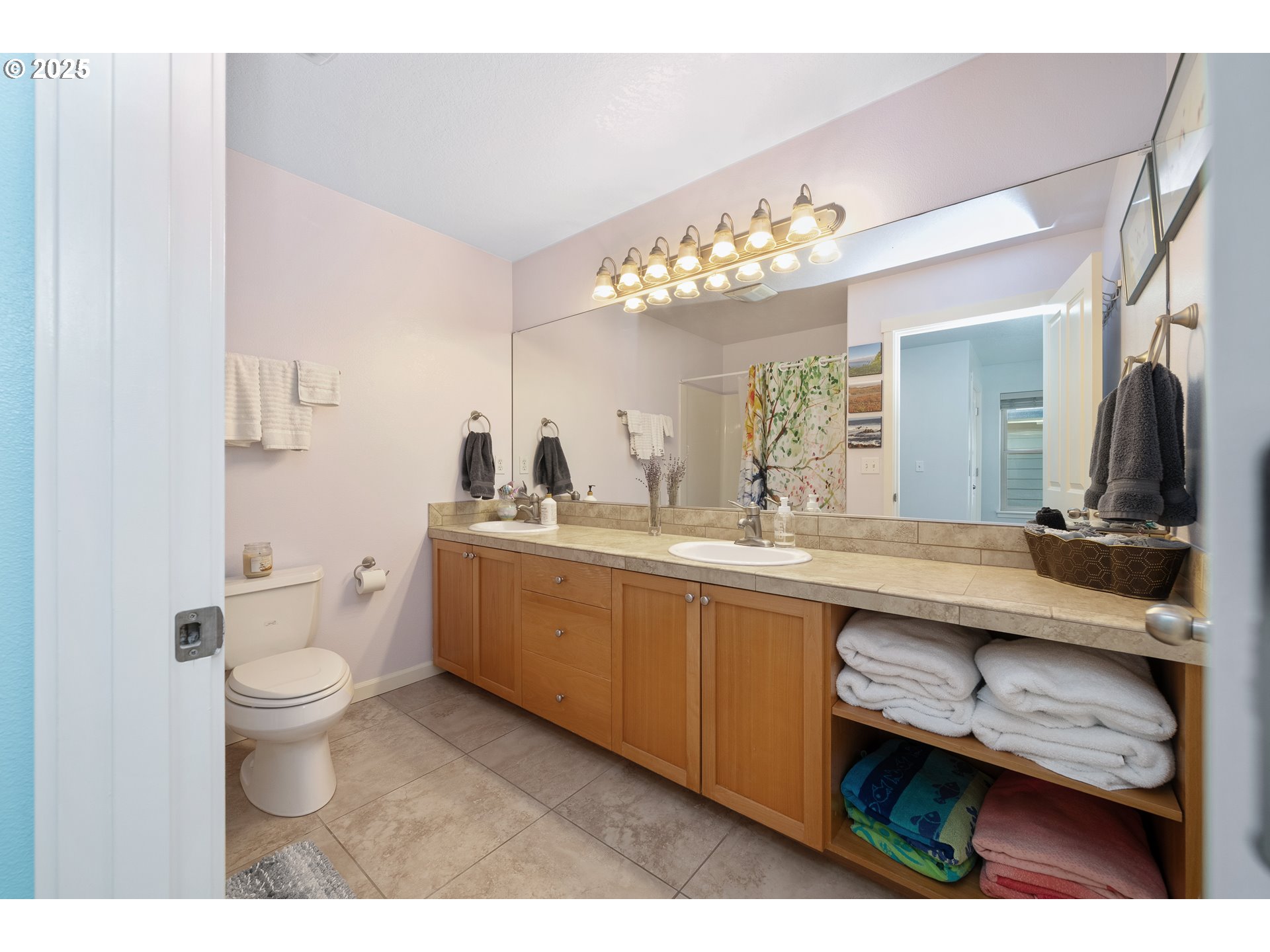 140 Breezee Way Tillamook, OR 97141 - Photo 26 of 46 a bathroom with a toilet a sink and a mirror