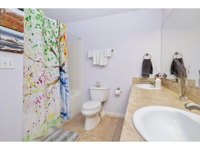 a spacious bedroom with a bed and a window