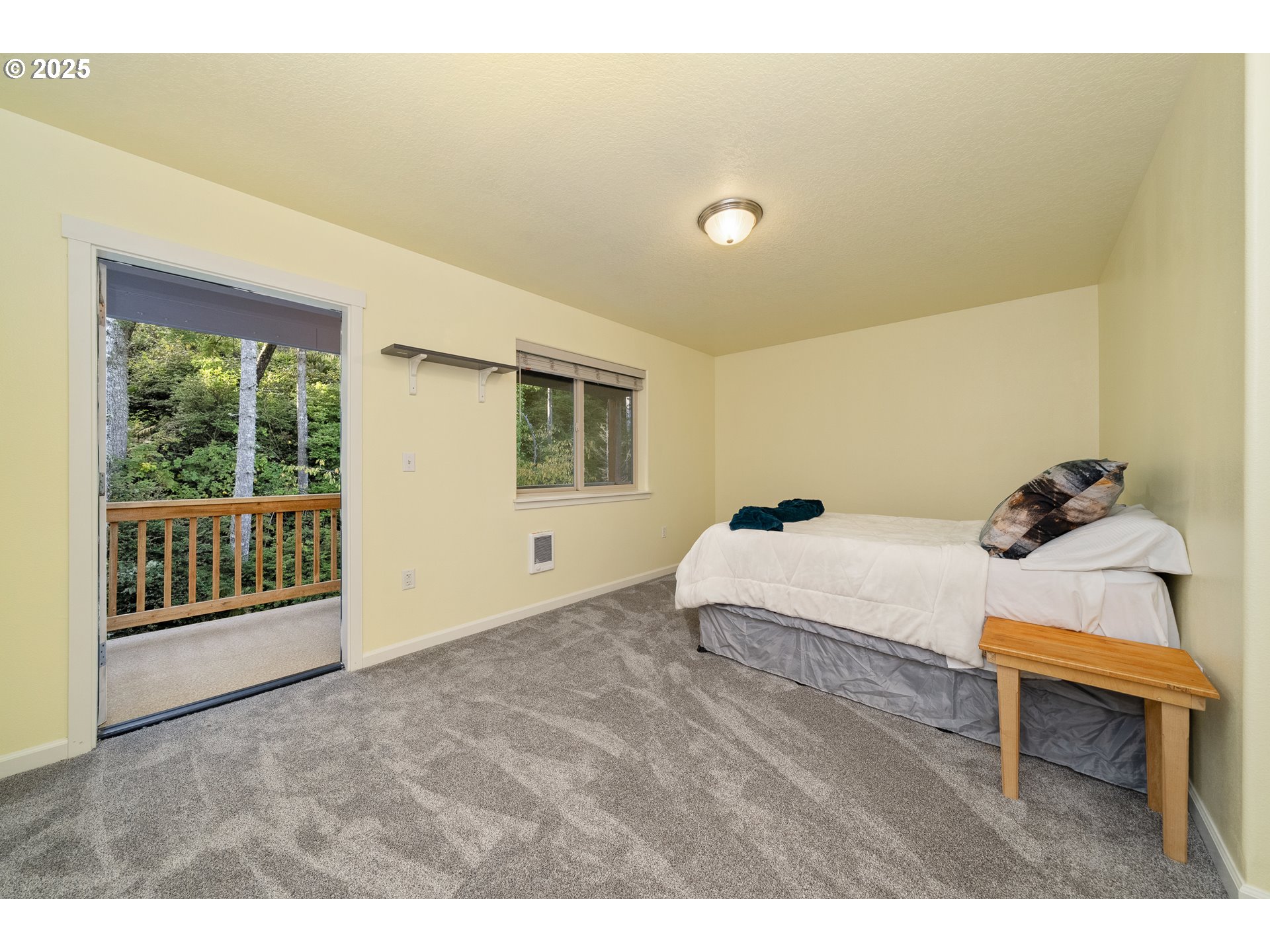 140 Breezee Way Tillamook, OR 97141 - Photo 28 of 46 a spacious bedroom with a bed and a window