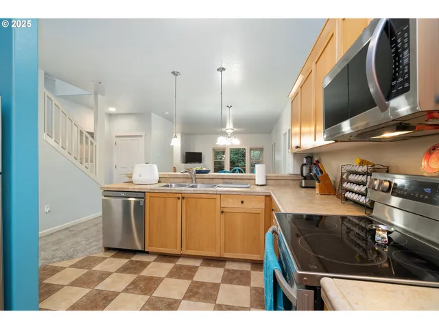 a bathroom with a sink vanity mirror and toilet