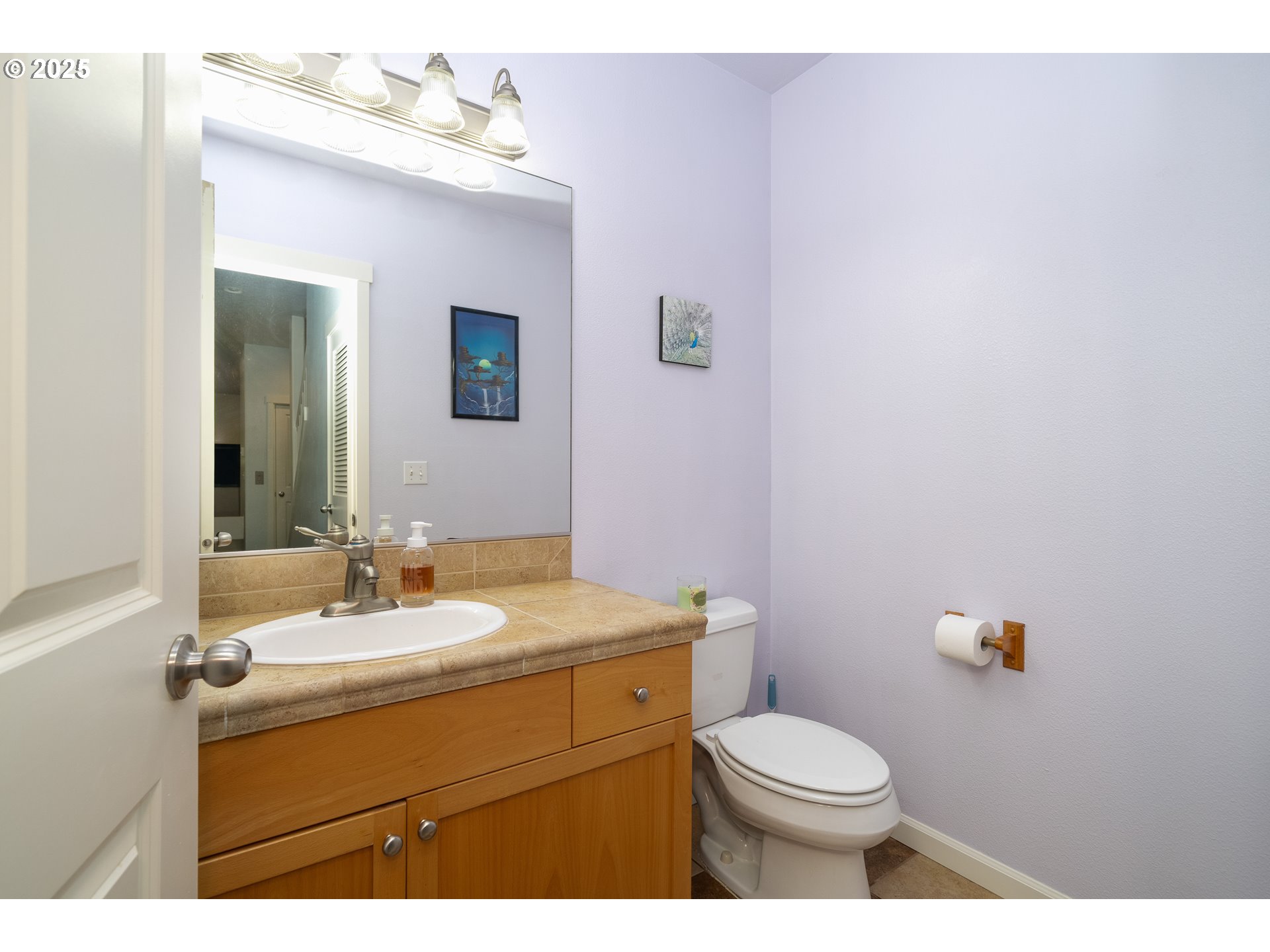 140 Breezee Way Tillamook, OR 97141 - Photo 37 of 46 a bathroom with a sink vanity mirror and toilet